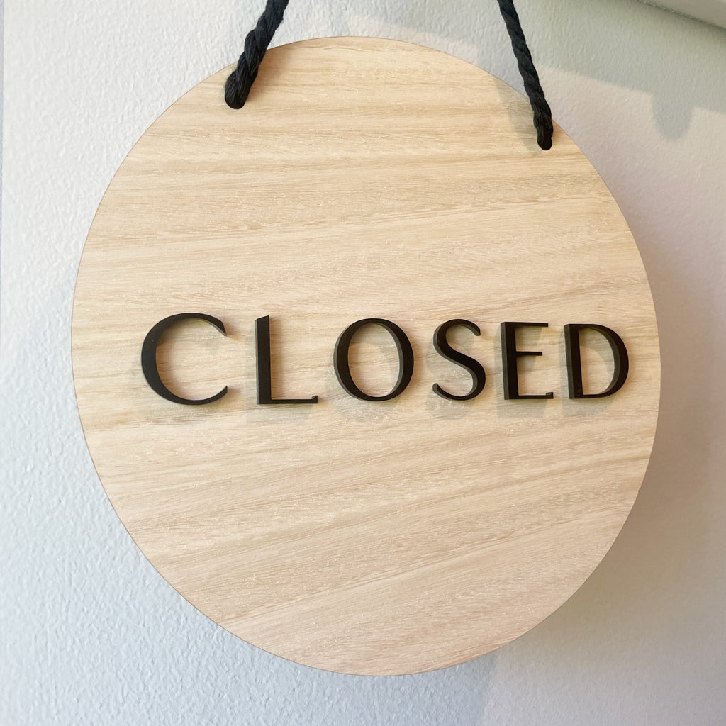 Wooden 'CLOSED' door sign for your shopfront. Black text on wood sign with black cord for hanging.