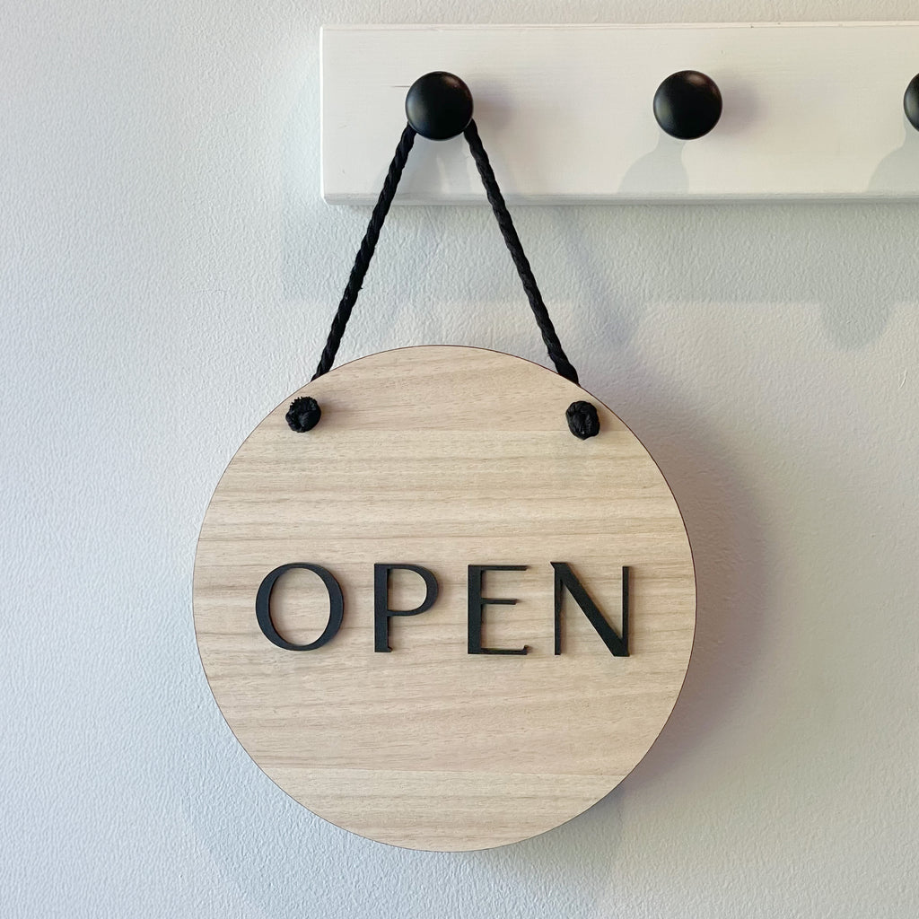 Wooden 'OPEN' door sign for your shopfront. Black text on wood sign with black cord for hanging.