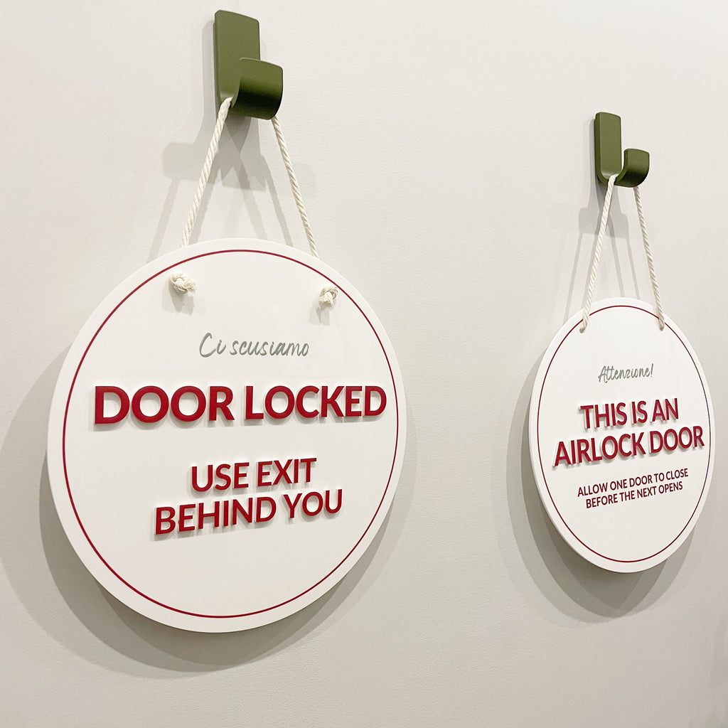 Two round coloured acrylic business signs. Hanging signs for businesses with bold printed text and 3D acrylic stand-off text.