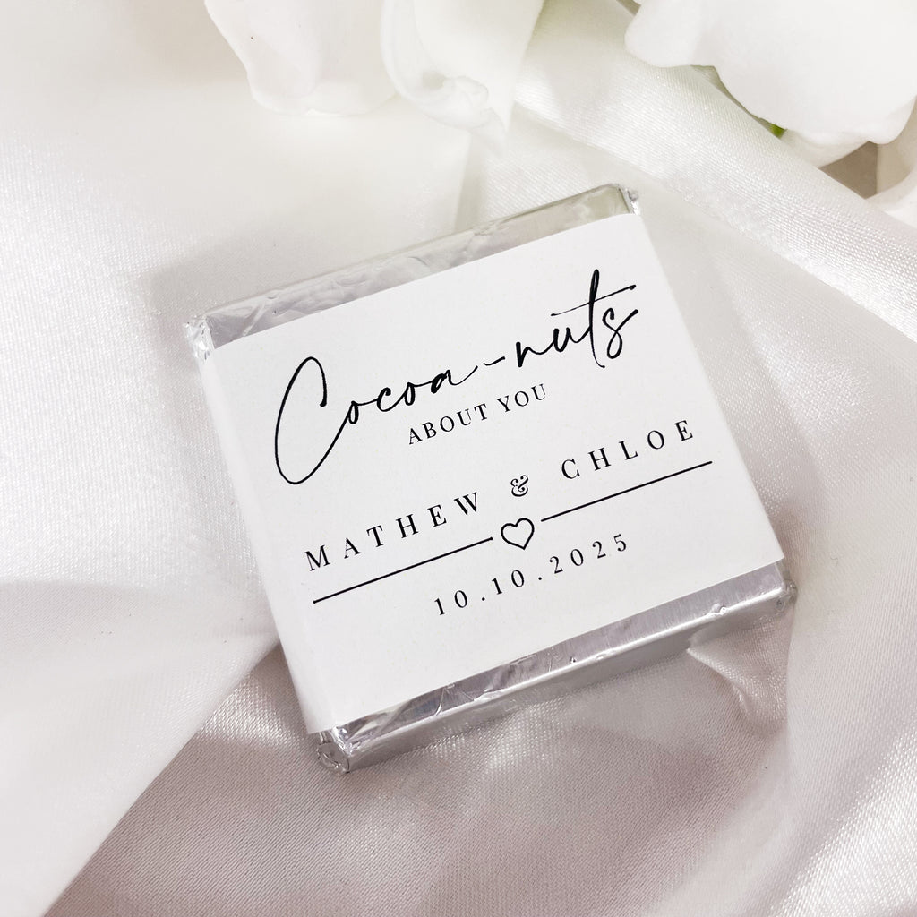 "Cocoa-nuts about you" minimalist wedding chocolates. Cute wedding favour ideas. Mini chocolate squares personalised with your names and date. 