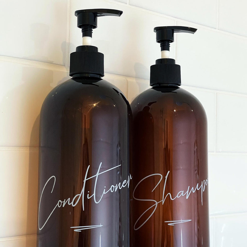 Cursive bathroom bottles with custom lettering. UV printed, with durable and long-lasting print.