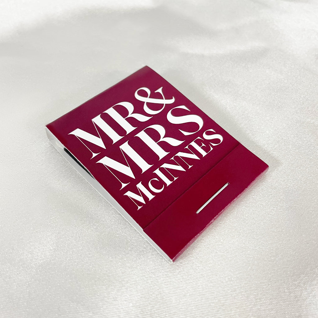 Mr and Mrs McInnes custom wedding matchbook favours in burgundy. Custom wedding matchbooks with personalised name and colours.