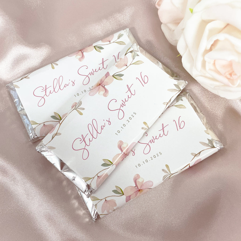 Pink floral Sweet 16 birthday chocolates. Custom wrapped chocolate bars for birthdays. Personalise with your own name, title, custom message and date. Silver foil chocolate bars with pink floral detail. 