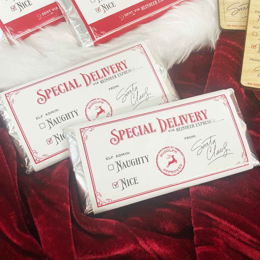 "Special Delivery" Christmas chocolate bar stocking stuffers - white wrapped Christmas "Naughty or Nice" chocolate bars from Santa Claus. Perfect for stocking stuffers, employee Christmas gifts, Christmas party gifts.